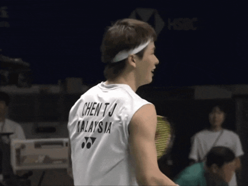 a man wearing a sleeveless shirt that says chen tj malaysia