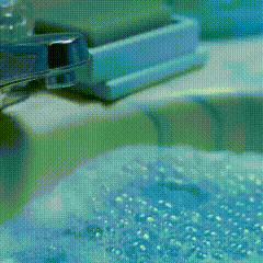 a bathroom counter with a sink a mirror and a toothbrush