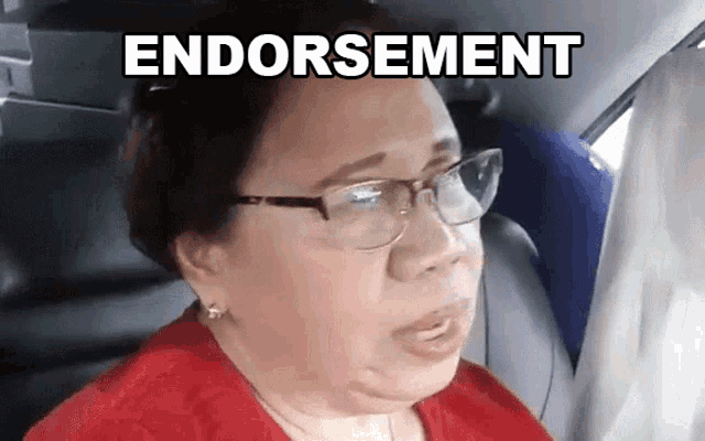 a woman wearing glasses is sitting in a car with the word endorsement written above her