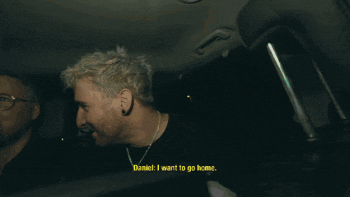 a man with glasses says daniel i just want to go home in a dark room