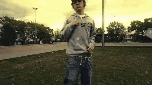 a young man wearing a sweatshirt that says sfc