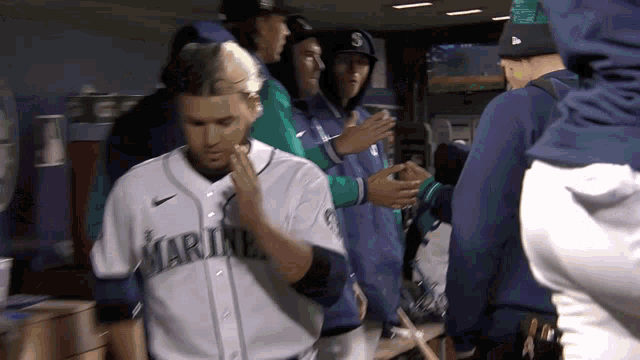 a baseball player wearing a jersey that says marines