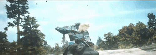 a person is riding a horse in a video game with a sword .