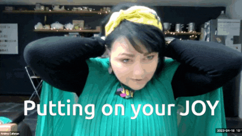 a woman in a green dress with the words putting on your joy