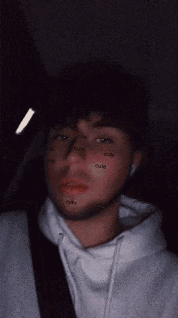 a man has the word cute on his face