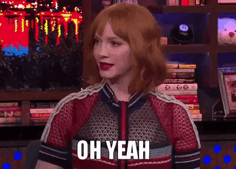 a woman with red hair says oh yeah