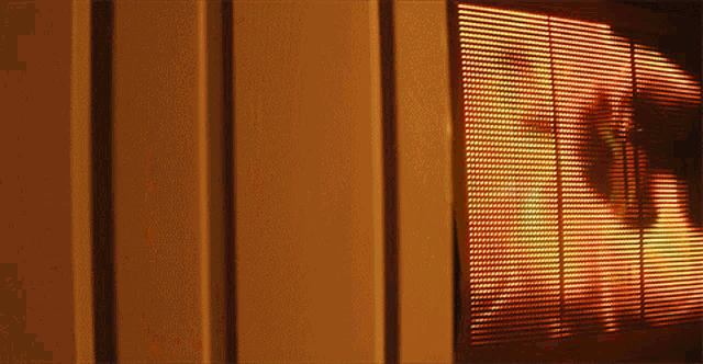 a close up of a wall with a screen behind it that says ' fire ' on it