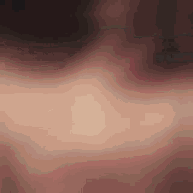 a close up of a person 's face with a blurry background
