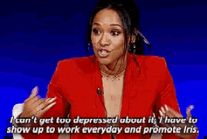 a woman in a red jacket says i can t get too depressed about it