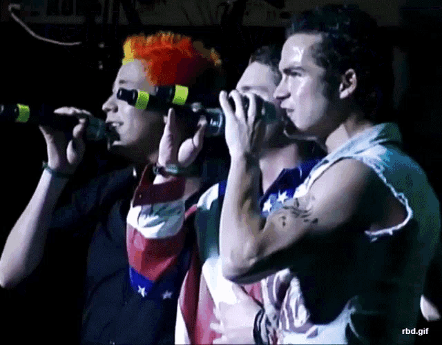 three men singing into microphones with rbd.gif written in the corner