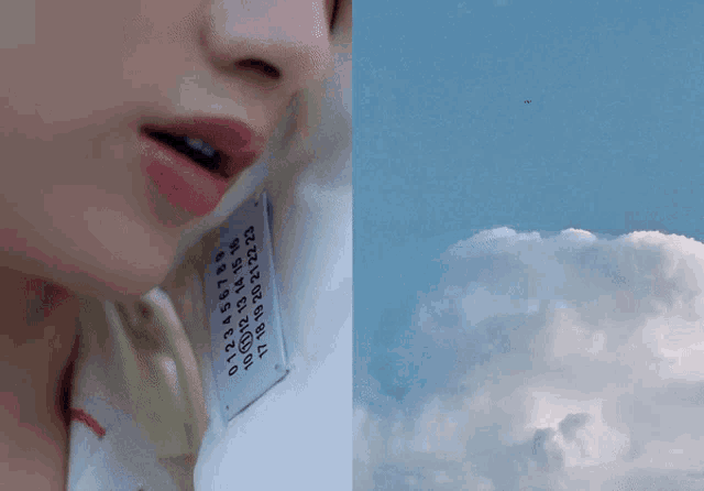 a woman talking on a phone next to a blue sky