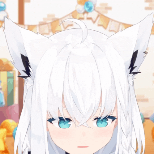 a girl with white hair and black ears is smiling with her mouth open