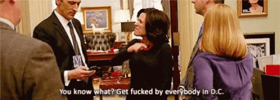 a group of people are standing in a room and one of them is saying " you know what " .