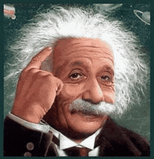 albert einstein is wearing a suit and tie and pointing his finger at his forehead .