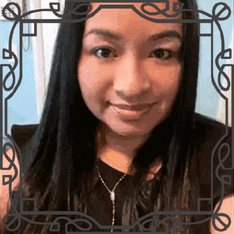 a woman 's face is framed by a black frame