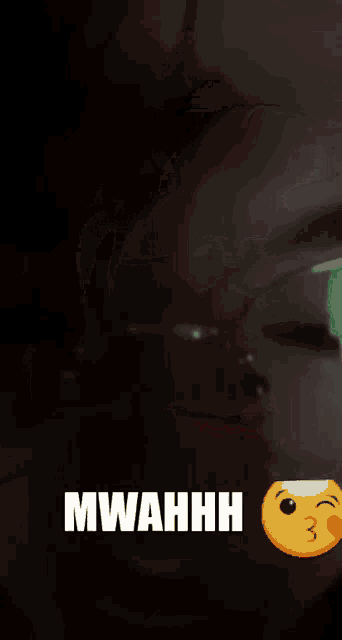 a woman wearing glasses says mwahhh next to a kissing smiley face