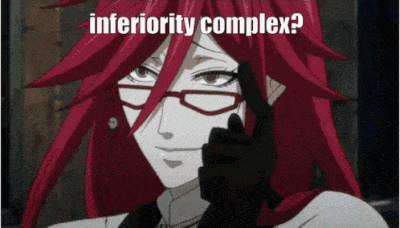 a cartoon character with red hair and glasses has the words inferiority complex above her head