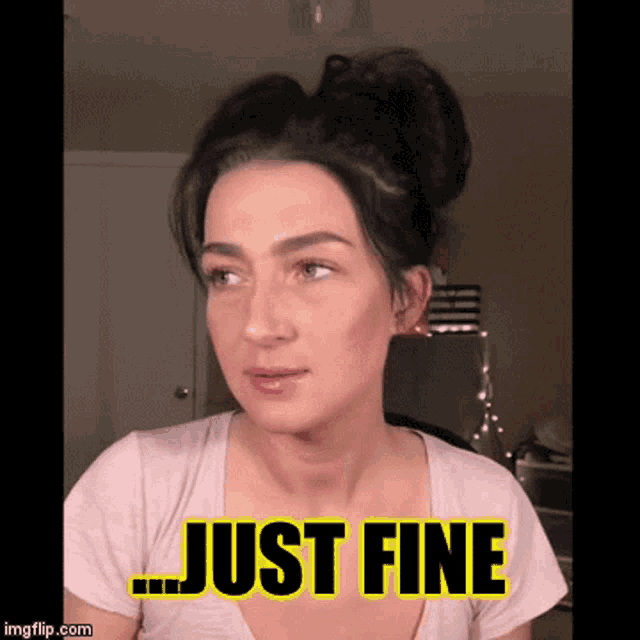a woman with a bun says just fine on her shirt
