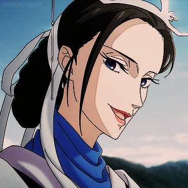 a close up of a woman 's face with a blue shirt and a white headband