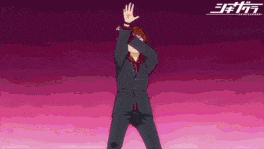 a man in a suit is doing a dab with his hand
