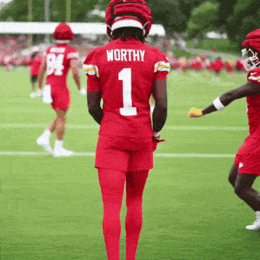 a football player in a red jersey with the number 1 on the back