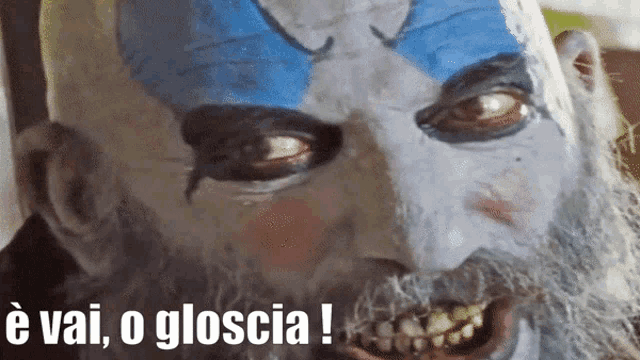 a close up of a clown with the words e vai o gloscia written on the bottom
