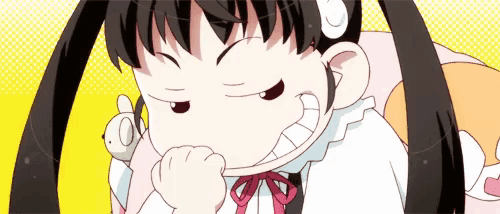 a girl with pigtails is making a funny face while holding a stuffed animal .