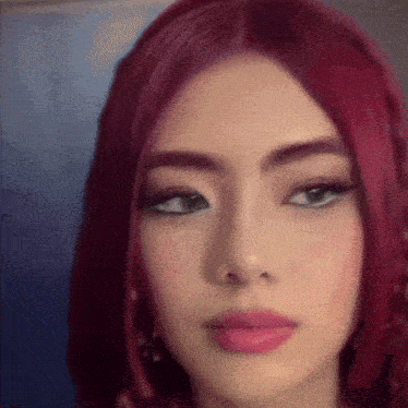 a close up of a woman with red hair