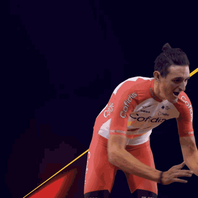 a man wearing a red and white cofidis uniform