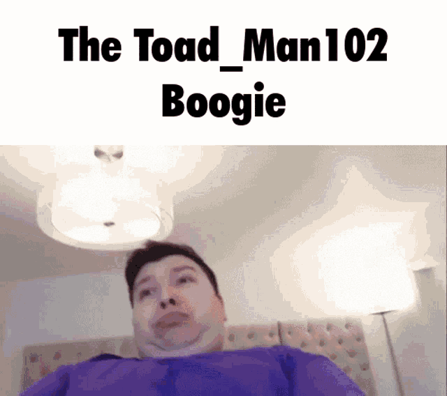 a man in a purple shirt is sitting on a bed with the words " the toad man 102 boogie " on the bottom