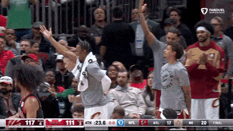 a basketball game is being played in front of a crowd
