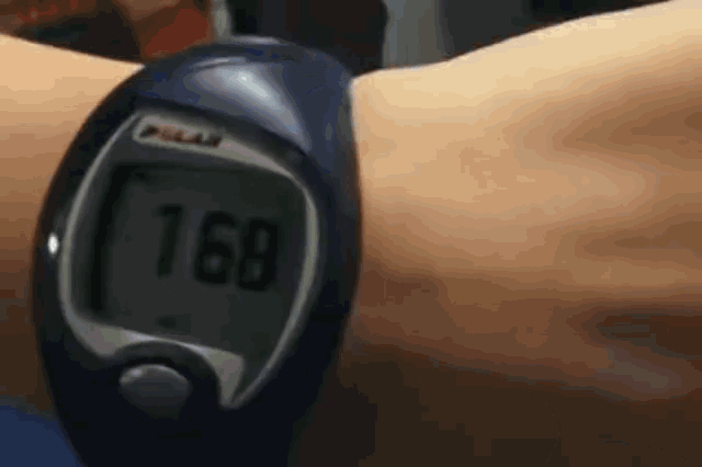 a person wearing a polar watch that says 168 on the screen