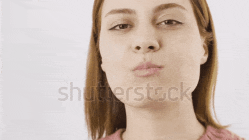 a close up of a woman 's face with the words shutterstock in the bottom right corner