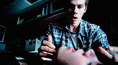 a man in a plaid shirt is talking to a woman