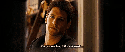 a man is talking about tax dollars at work