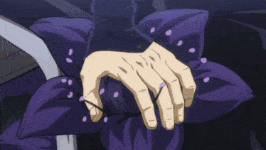 a man in a suit and tie holds a purple object in his hand