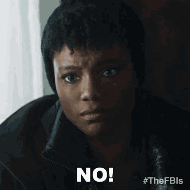 a close up of a woman 's face with the words " no " on the bottom