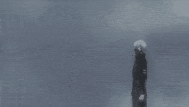 a man in a black jacket is standing next to another man