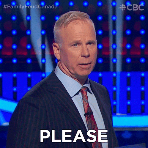 a man in a suit and tie is asking for a please