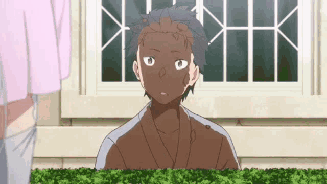a cartoon character with a dirty face is standing in front of a window .