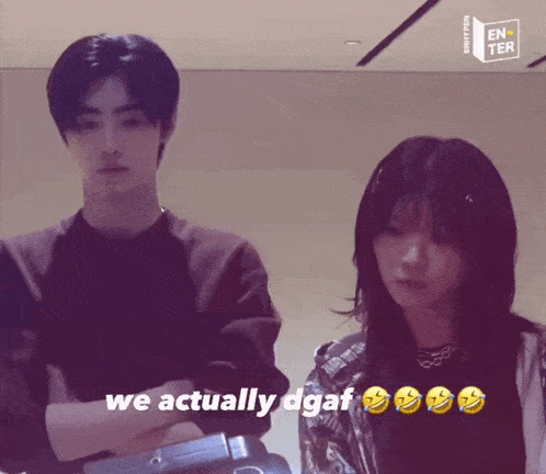 a man and a woman are standing next to each other and the words we actually dgaf are visible