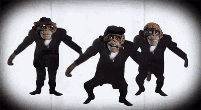 three chimpanzees in suits and hats are dancing