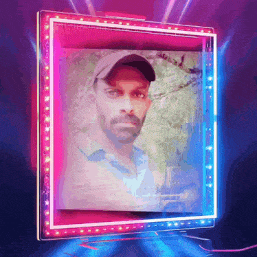 a picture of a man in a baseball cap is displayed on a neon sign