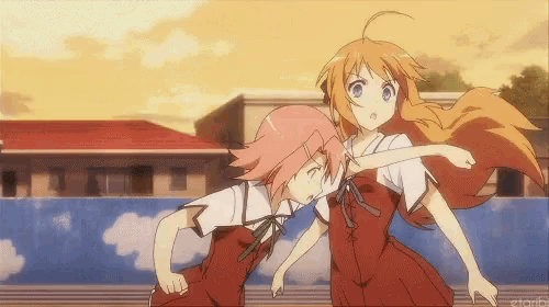 a couple of anime girls standing next to each other with a building in the background