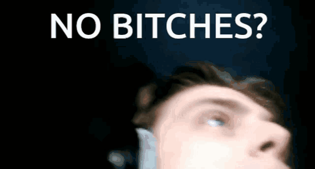 a blurry picture of a man with the words " no bitches " on the top