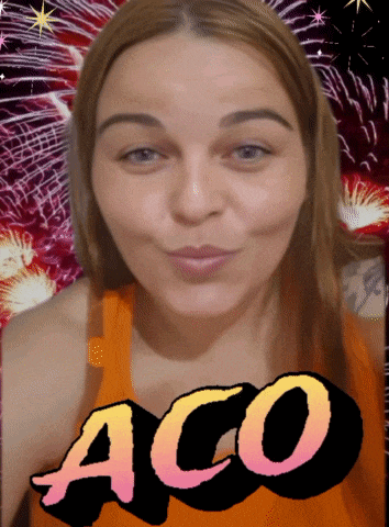 a woman blowing a kiss in front of fireworks and the word aco