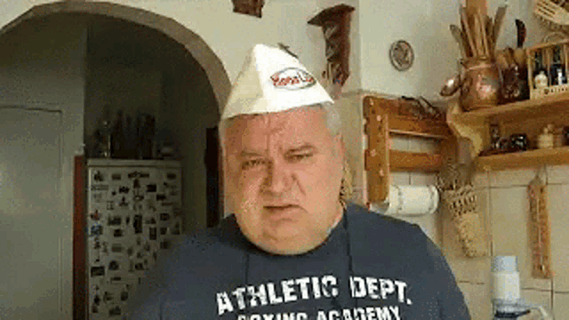 a man wearing a blue shirt that says athletic dept on it