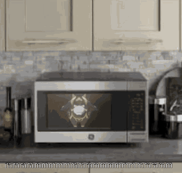 a microwave with a picture of a cartoon character on the screen