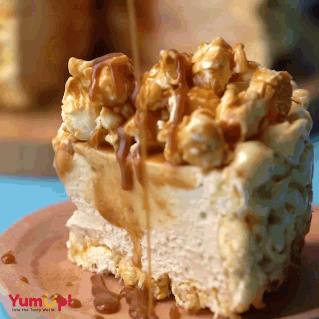 a piece of cake with caramel being poured on it is on a plate that says yum apple