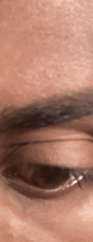 a close up of a person 's eye with a few tears coming out of it